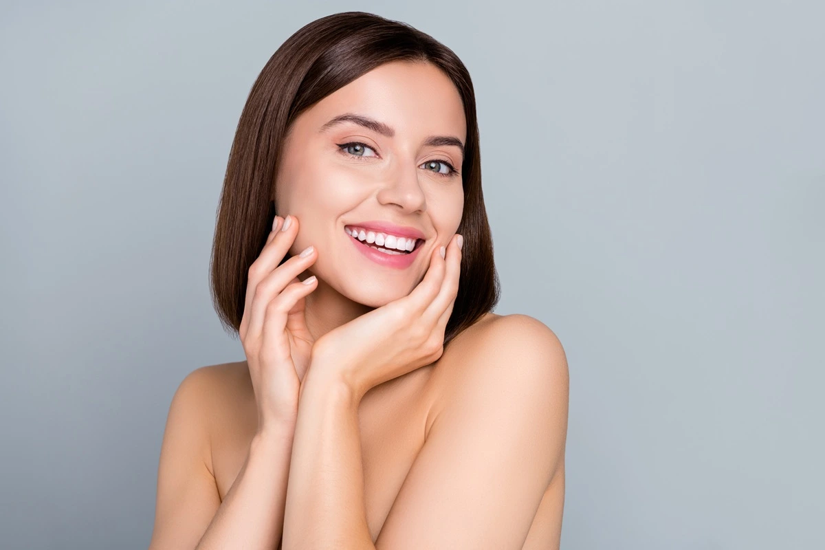 Smiling woman with clear glowing complexion