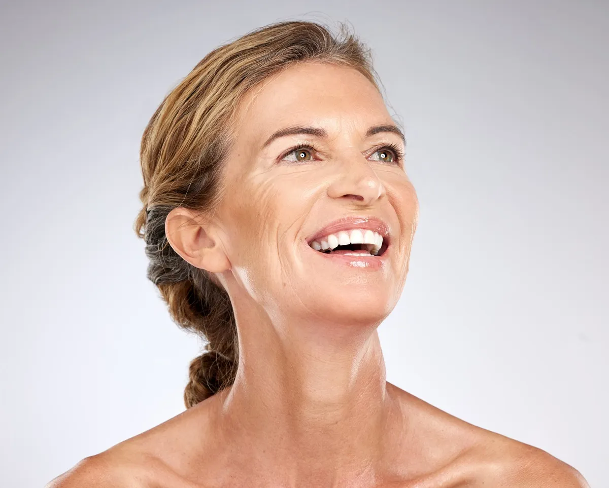 Mature woman smiling with youthful skin