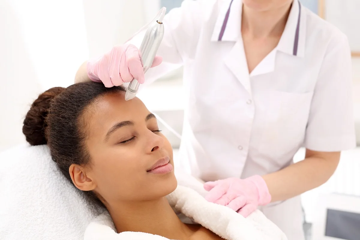 Microdermabrasion treatment being performed in medical spa clinic