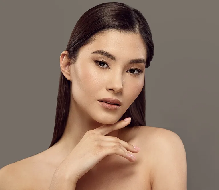 Woman with flawless complexion posing in studio portrait