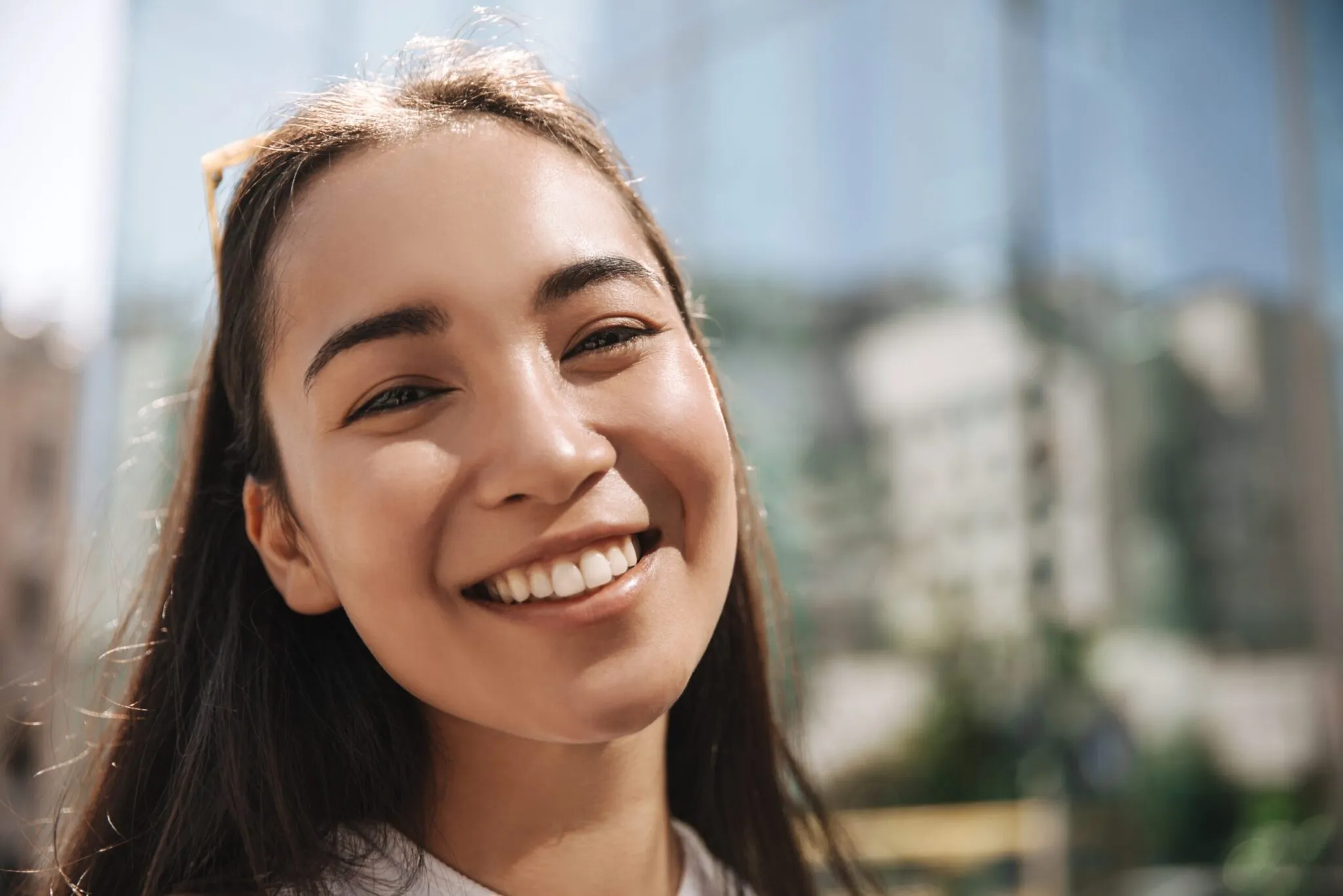 Smiling woman with fresh healthy facial skin